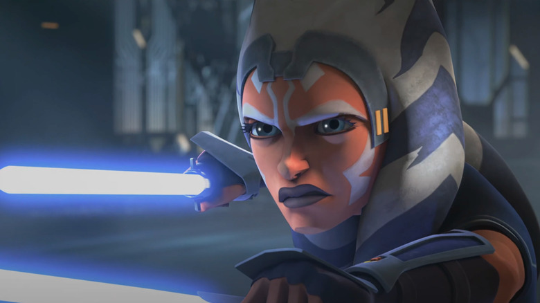 Ahsoka prepares for battle, holding lightsaber